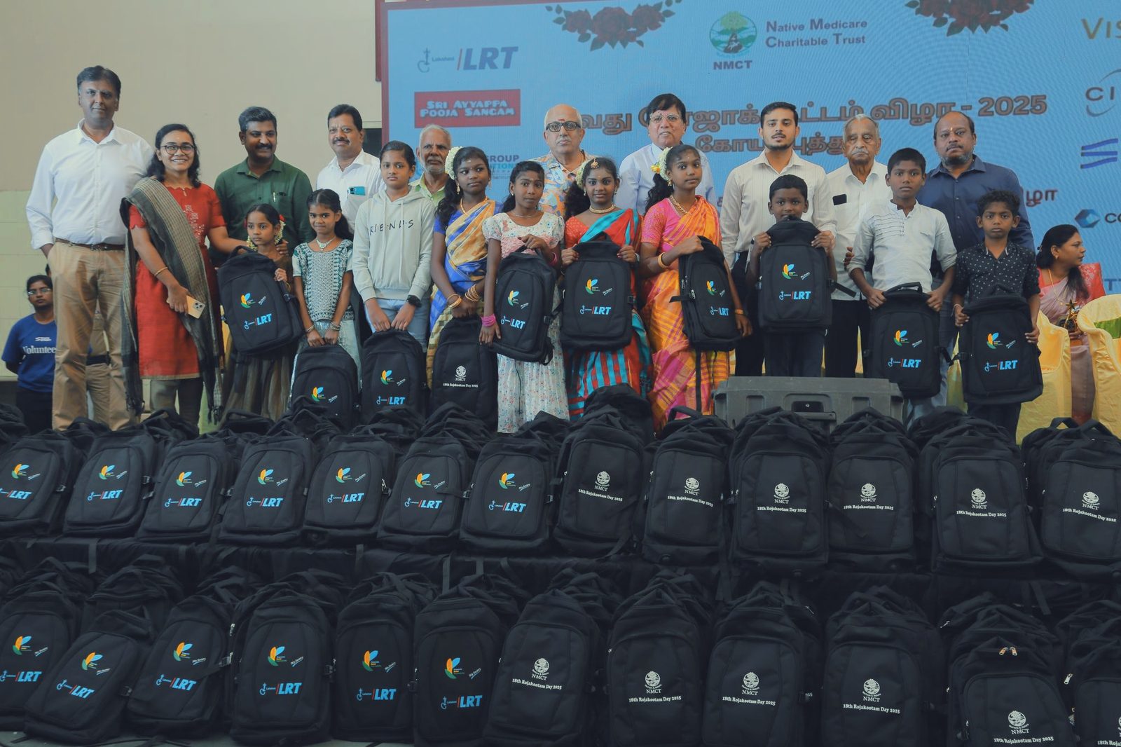 Schoolchildren receiving learning kits at an NMCT education programme
